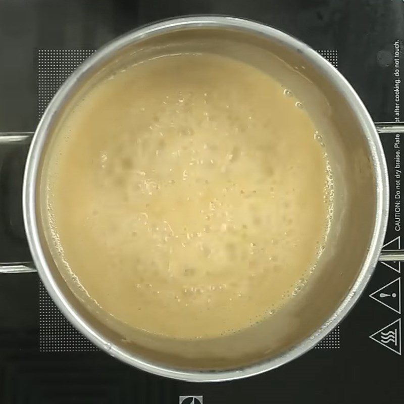 Step 2 Cook coconut milk for mung bean and coconut sticky rice cake