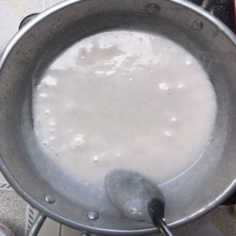 Step 5 Cook the coconut milk Cassava banana cake