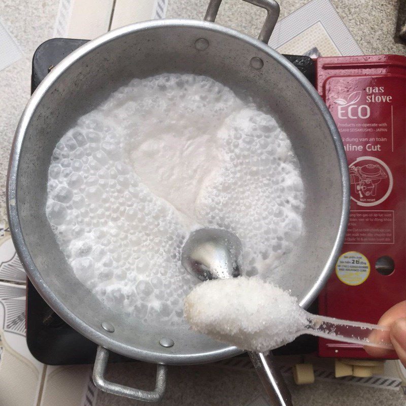 Step 5 Cook coconut milk for cassava banana cake