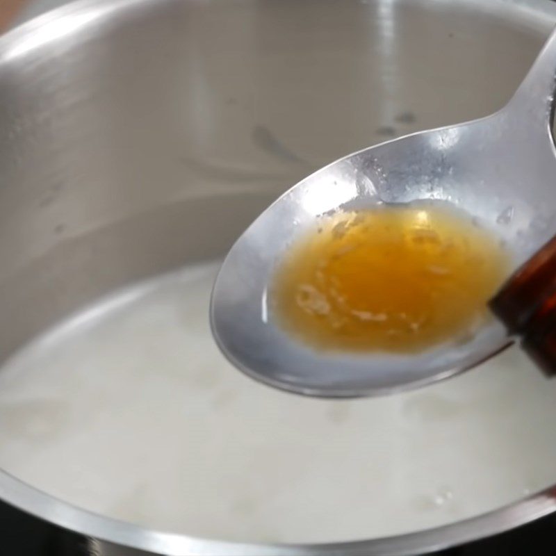 Step 5 Cooking coconut milk for sago pudding with pomegranate seeds