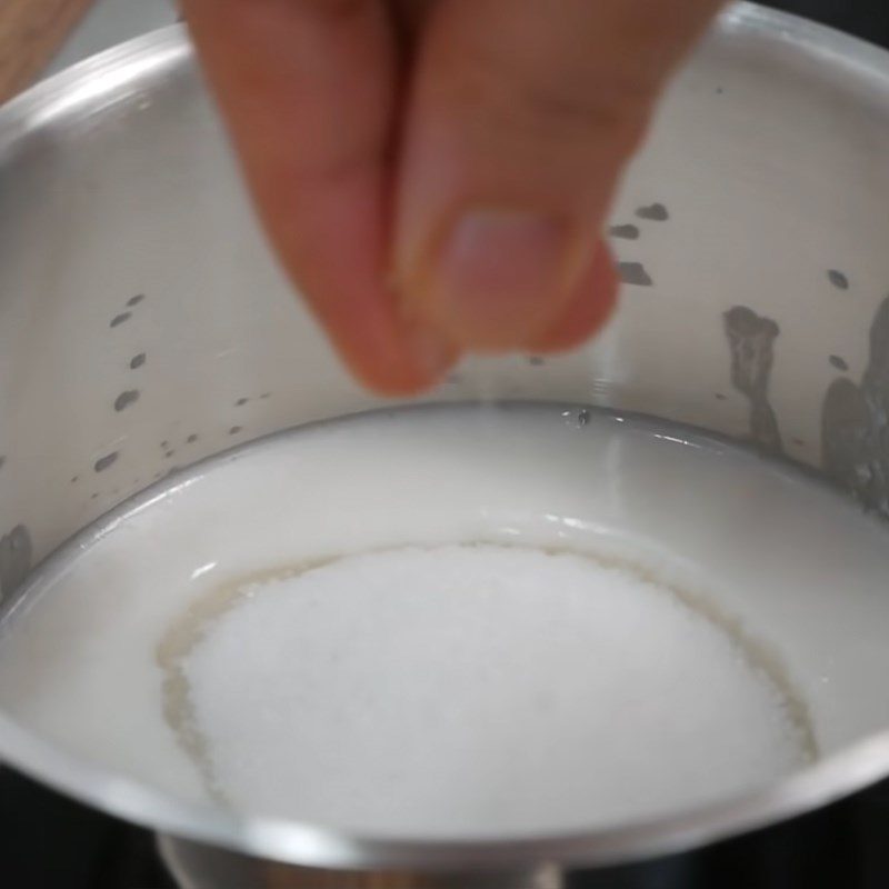 Step 5 Cooking coconut milk for sago pudding with pomegranate seeds