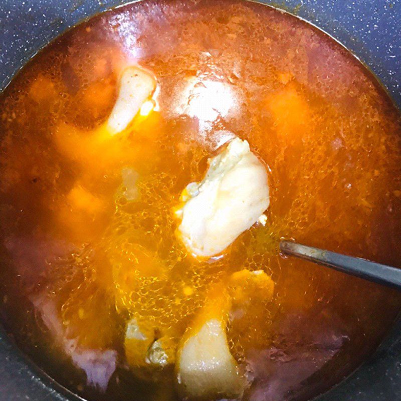 Step 5 Cooking broth for Quang noodles with pig's trotter