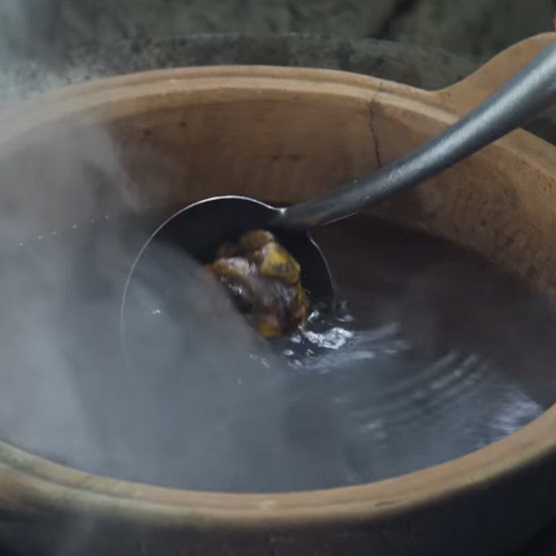 Step 3 Cook the tamarind water Sour fish soup with water spinach