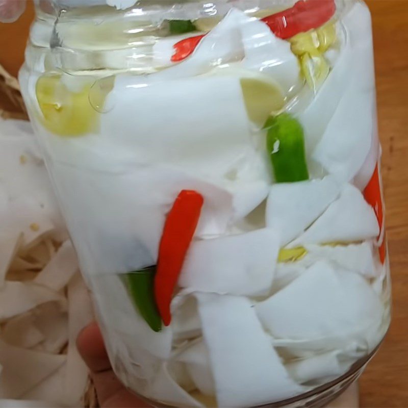 Step 3 Cook the soaking water and soak the bamboo shoots Sour bamboo shoots with garlic and chili