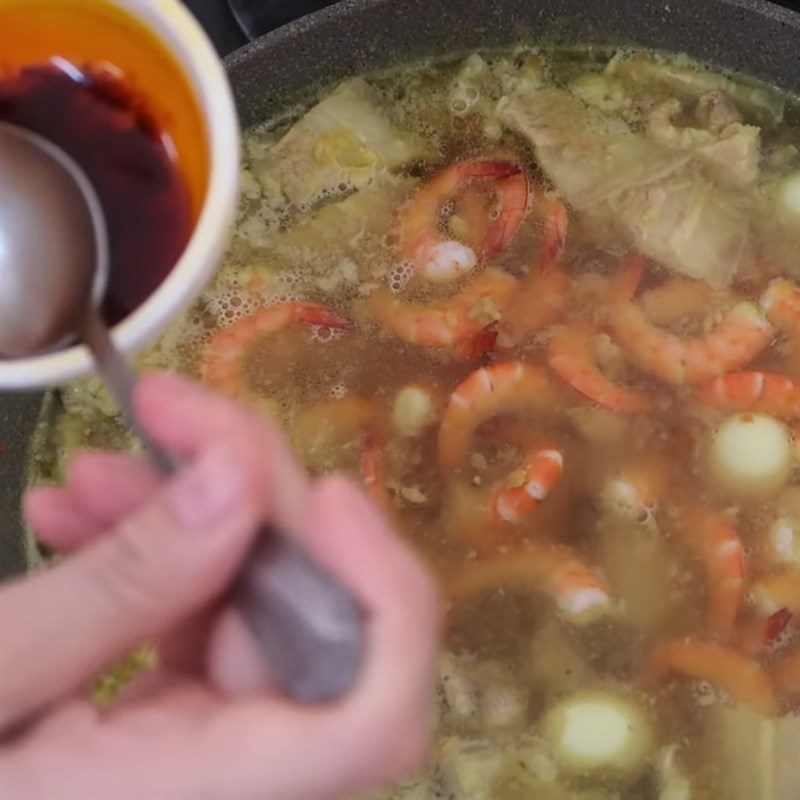 Step 7 Cooking the broth Quang noodle with shrimp and pork