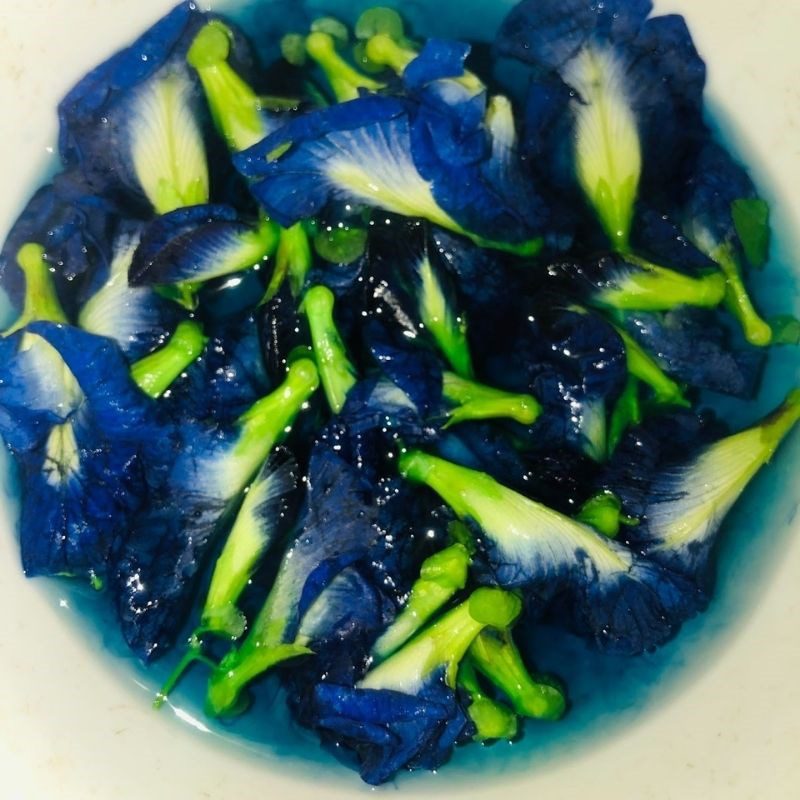 Step 2 Soak butterfly pea flowers with orange