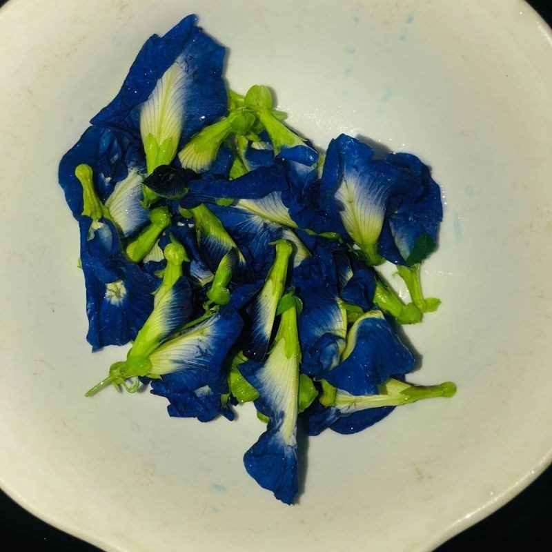 Step 2 Soak butterfly pea flowers with orange