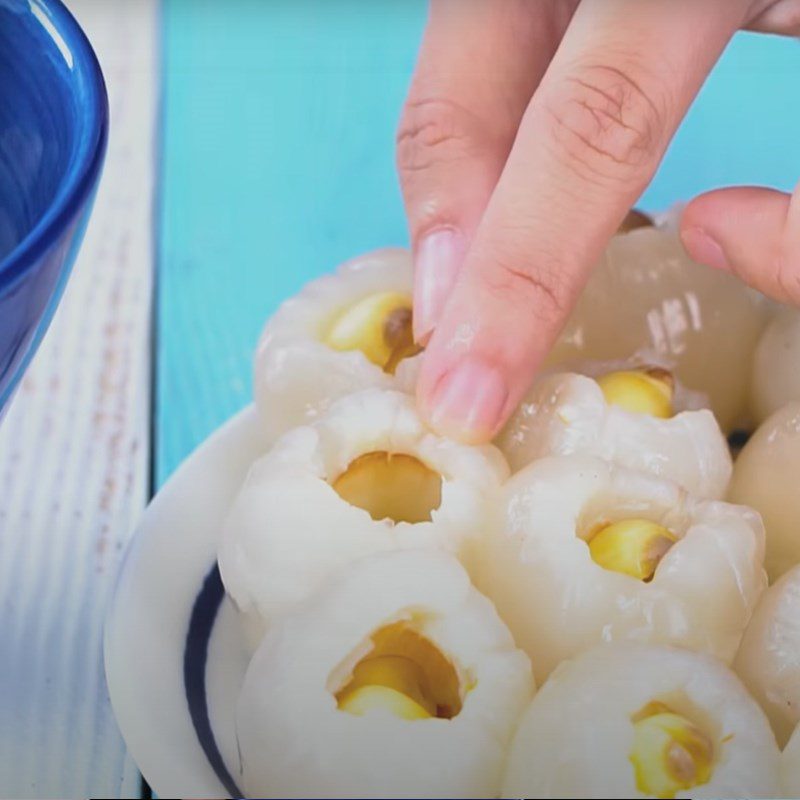 Step 2 Stuff the lotus seeds into the lychee Lychee and Lotus Seed Sweet Soup