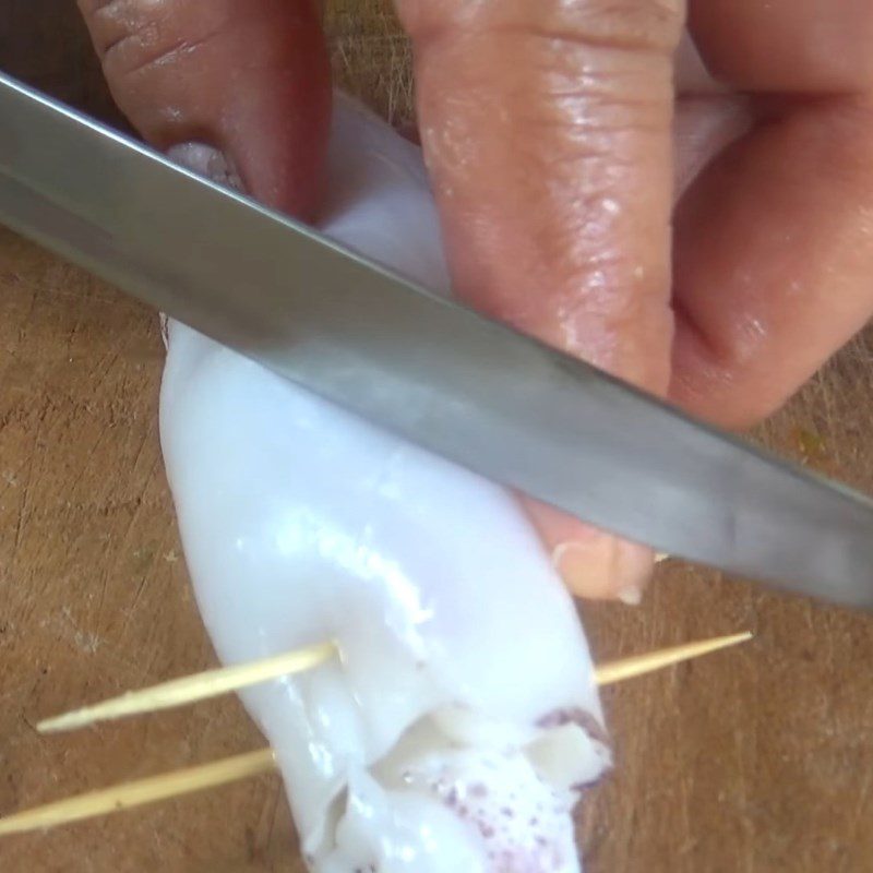 Step 3 Stuffing the meat and marinating the squid Grilled squid stuffed with meat and satay