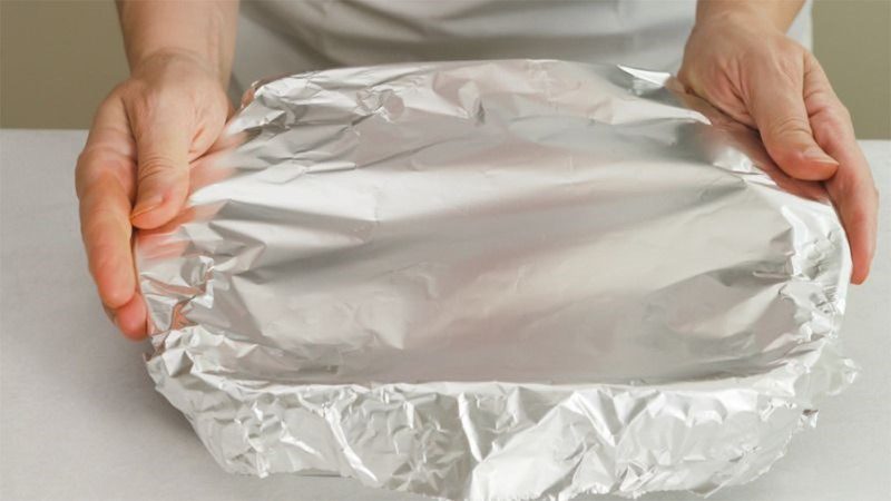 You can use aluminum foil to cover the mooncake when baking