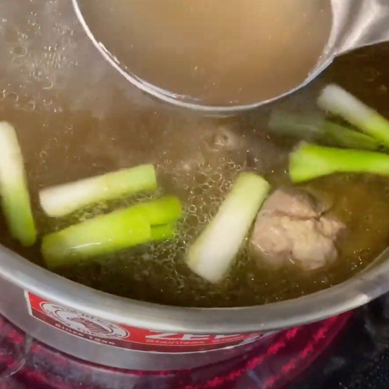 Step 2 Simmer the broth for Dry Pho Gia Lai