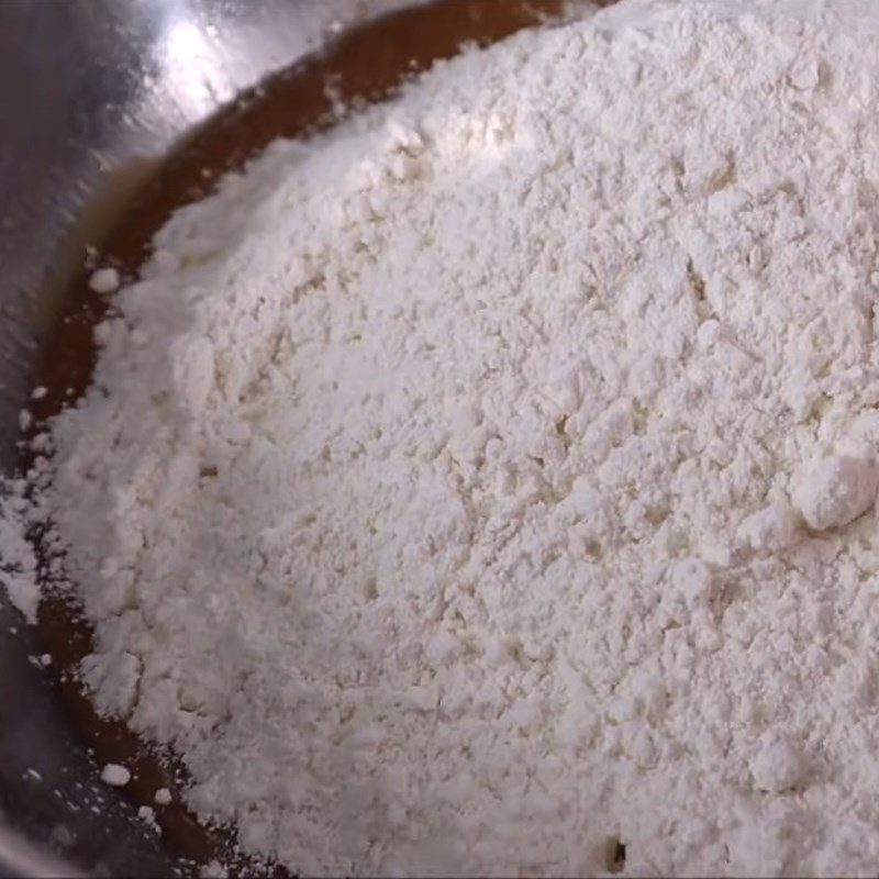 Step 5 Mixing cake dough Mooncake with black sesame and salted egg