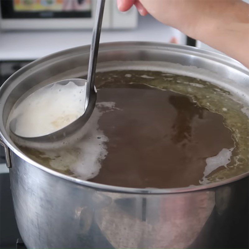 Step 4 Strain the broth for bone-free beef pho