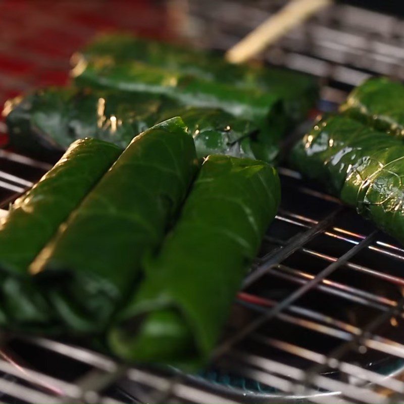 Step 3 Grilling the fish Snakehead fish wrapped in betel leaves