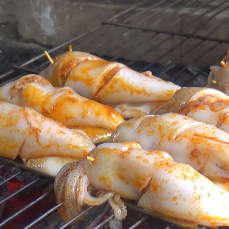 Step 4 Grilling the squid Grilled squid stuffed with meat and satay