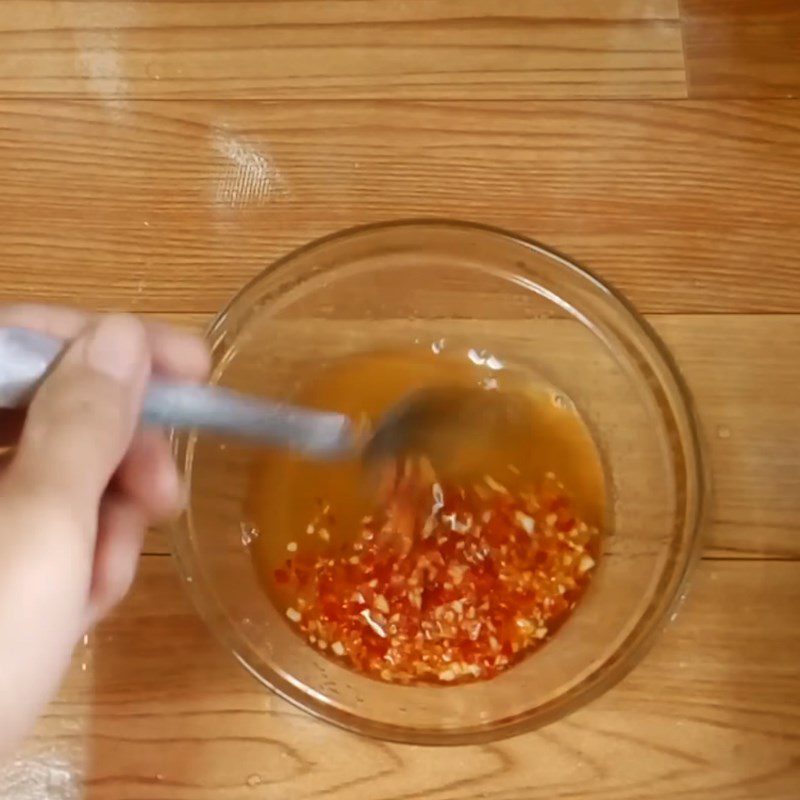 Step 2 Mix the dipping sauce Fish sauce mixed with lime, garlic, and chili