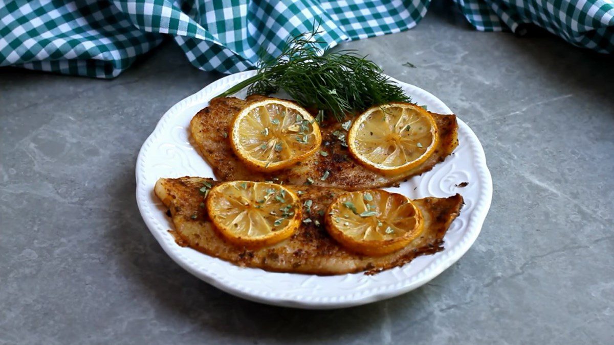 Grilled basa fish fillet with butter and lemon