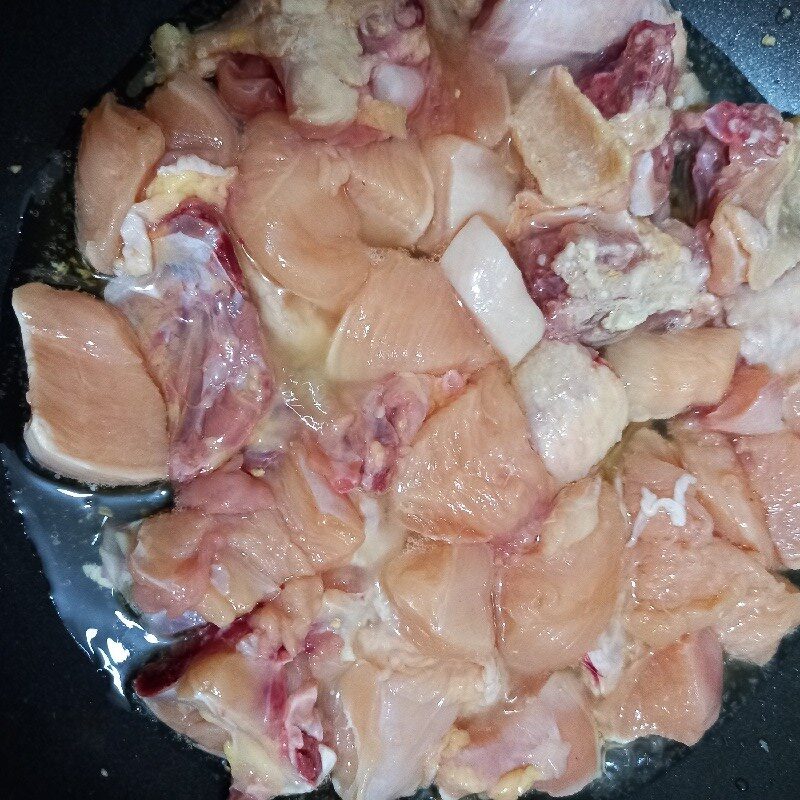 Step 2 Sauté minced garlic and fry chicken Chicken with tamarind