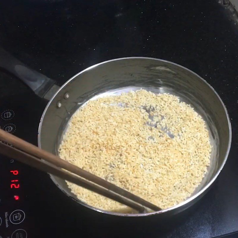 Step 1 Roasting Dried Rice for Dried Rice with Black Sesame Sugar