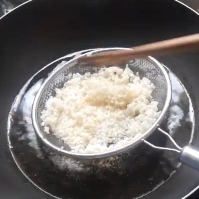 Step 1 Frying dry rice Dry rice caramelized with palm sugar