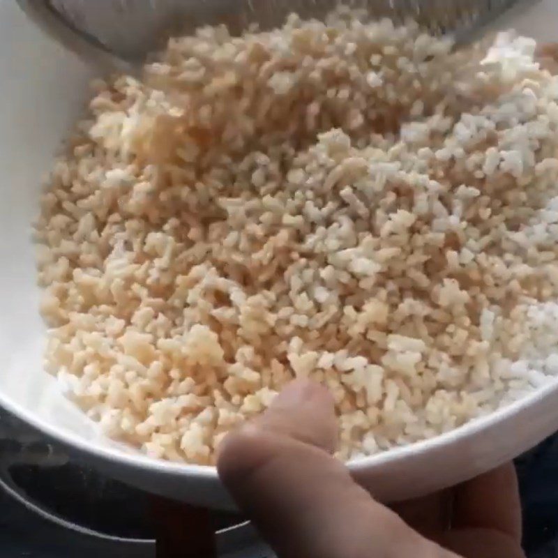 Step 1 Frying dry rice Dry rice caramelized with palm sugar