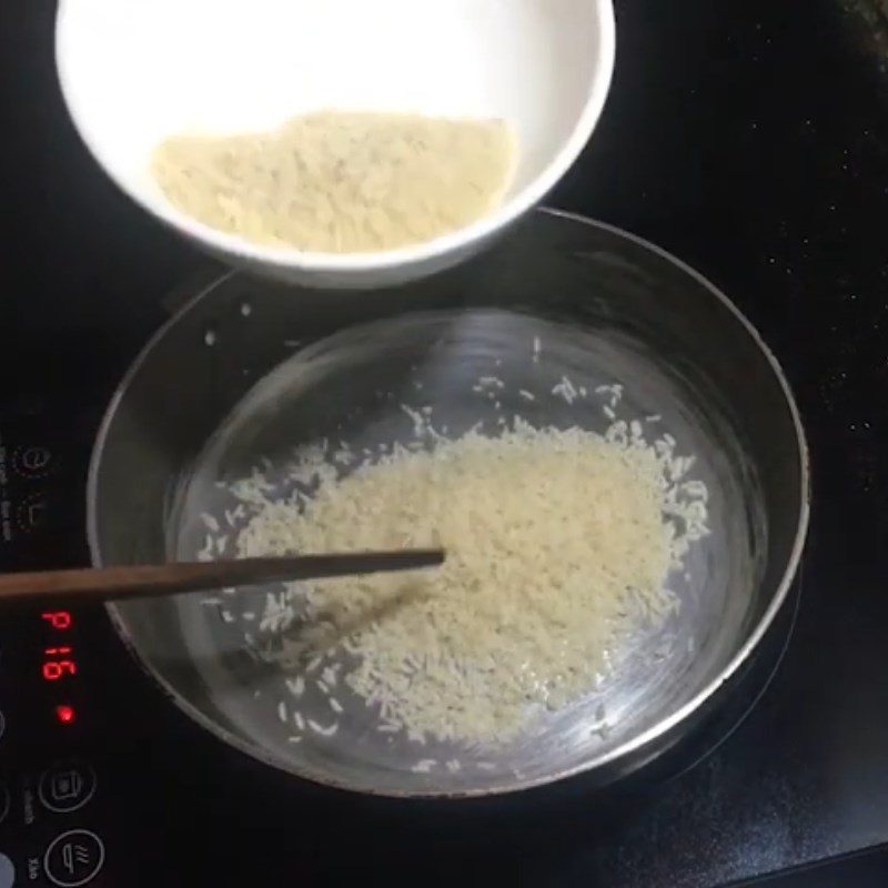 Step 1 Roasting Dried Rice for Dried Rice with Black Sesame Sugar