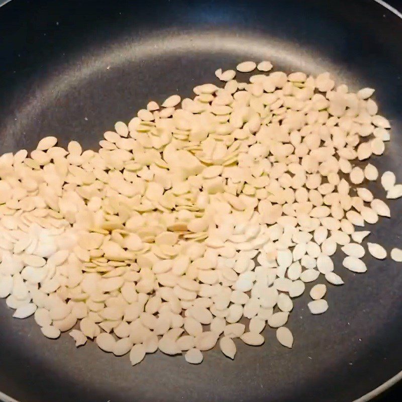 Step 1 Roast peanuts and watermelon seeds for Red Peanut Candy