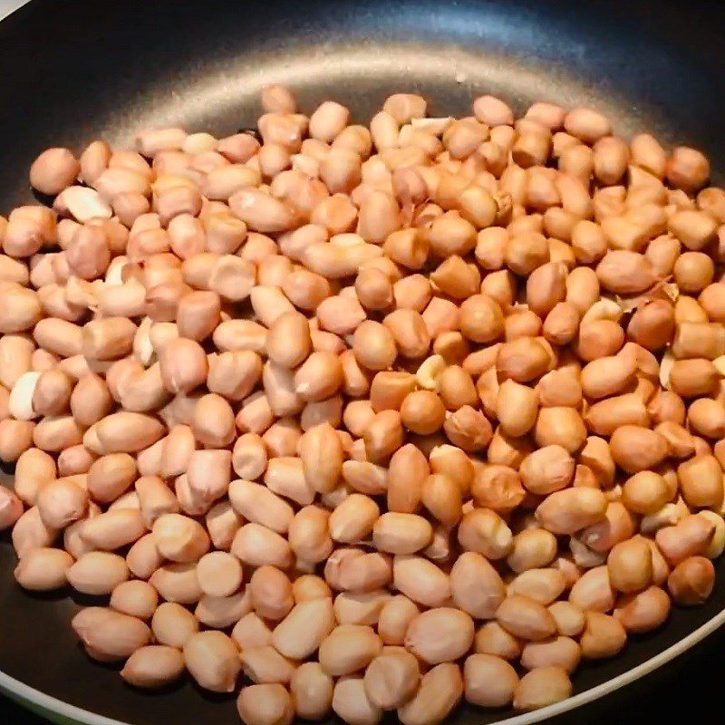 Step 1 Roast peanuts and watermelon seeds for Red Peanut Candy