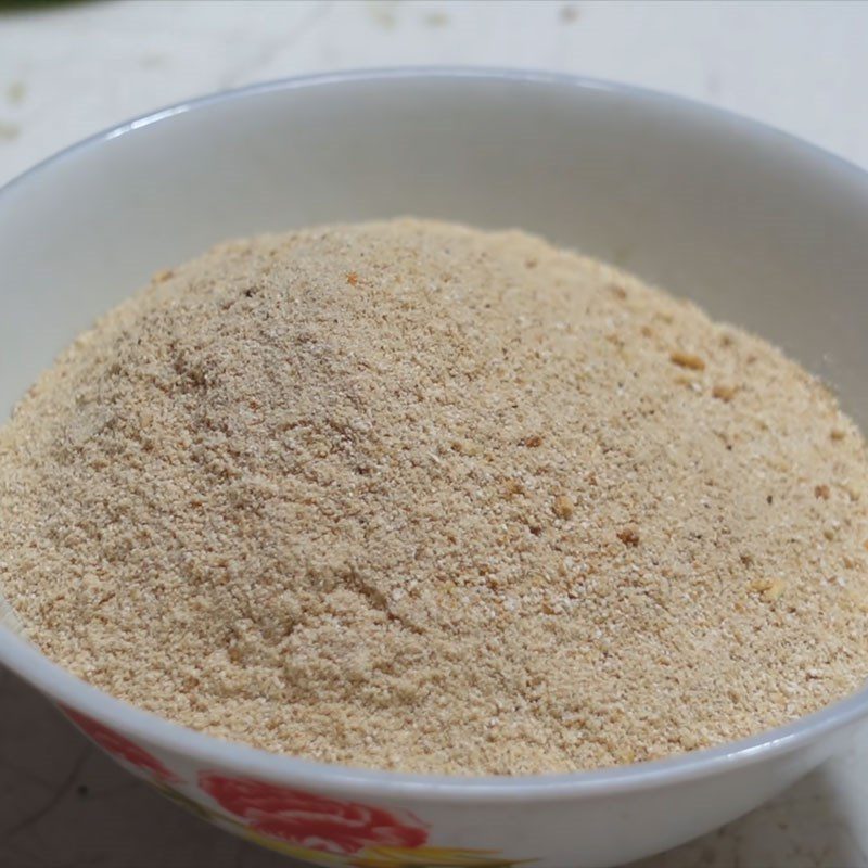 Step 3 Roasting and grinding rice for the river catfish salad