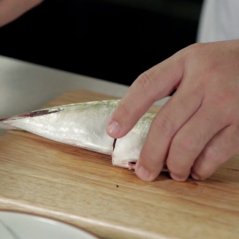 Step 1 Prepare and marinate the catfish Sour bamboo shoot soup with catfish