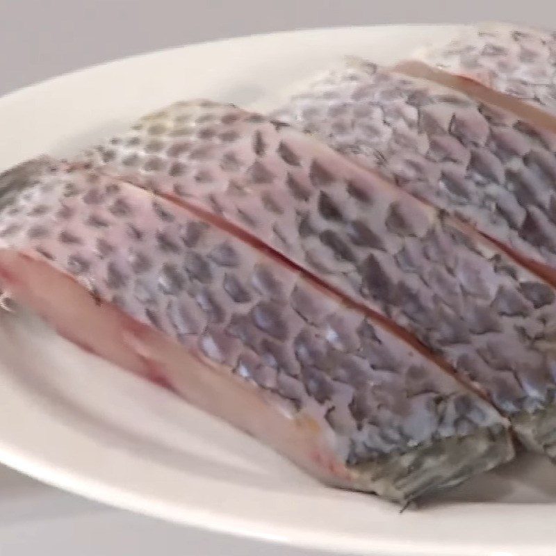 Step 1 Prepare tilapia Braised tilapia with turmeric sauce