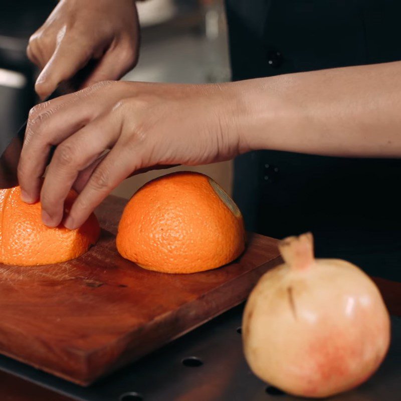 Step 1 Prepare orange and pomegranate for Orange Pomegranate Detox Drink