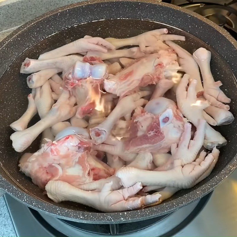 Step 1 Prepare chicken feet and pork bones for Abalone Soup with Pork Ribs and Wax Gourd