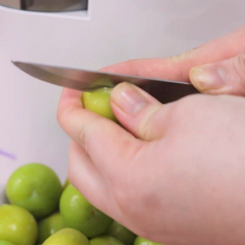 Step 1 Preparing plums for Sơn La Plum Juice