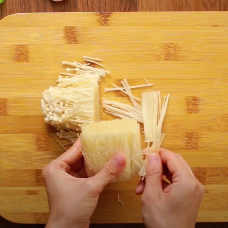 Step 2 Prepare the enoki mushrooms for Beef Ball Soup with Enoki Mushrooms