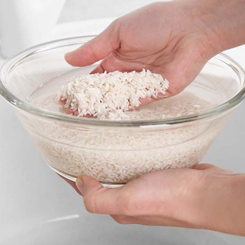 Step 1 Wash and soak glutinous rice for Soft Corn Sticky Rice (Steamed Corn) using rice cooker