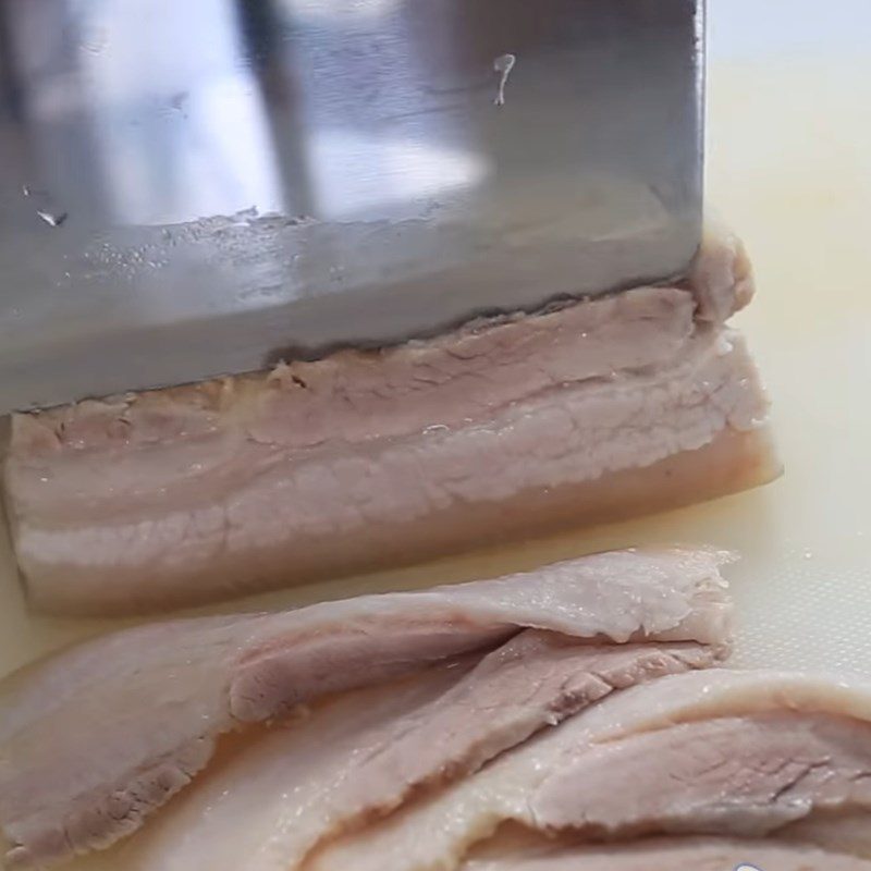 Step 1 Prepare and boil pork belly for Sour Shrimp Rice Rolls