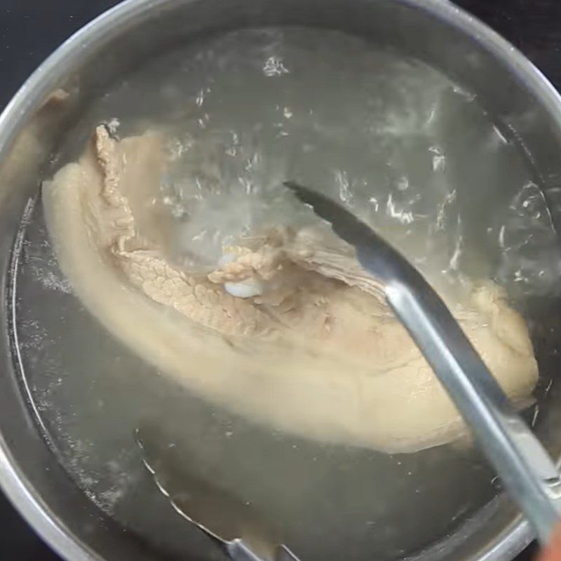 Step 1 Prepare and boil pork belly for Sour Shrimp Rice Rolls