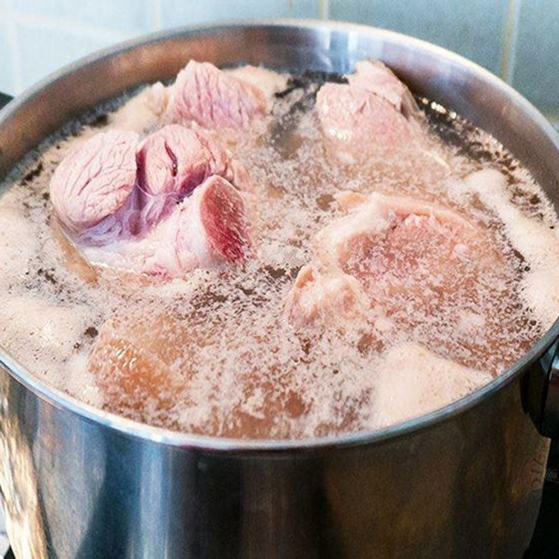 Step 2 Preparing and blanching the pork bones for Lotus Root Soup with Pork Bones