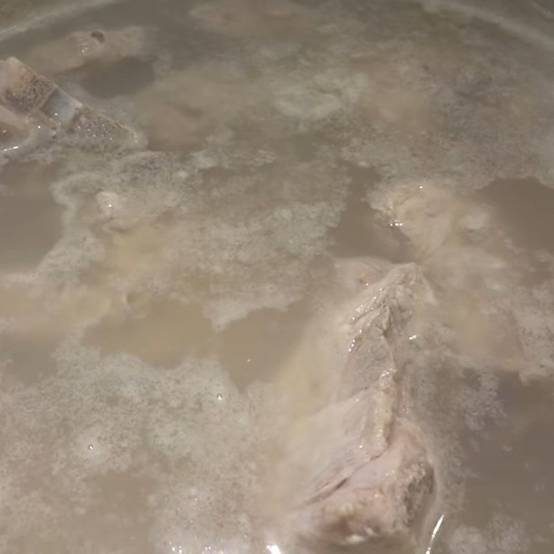 Step 2 Prepare and boil the pork bones Pickled radish soup (xá bấu)