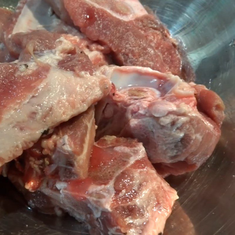 Step 2 Prepare and boil the pork bones Pickled radish soup (xá bấu)