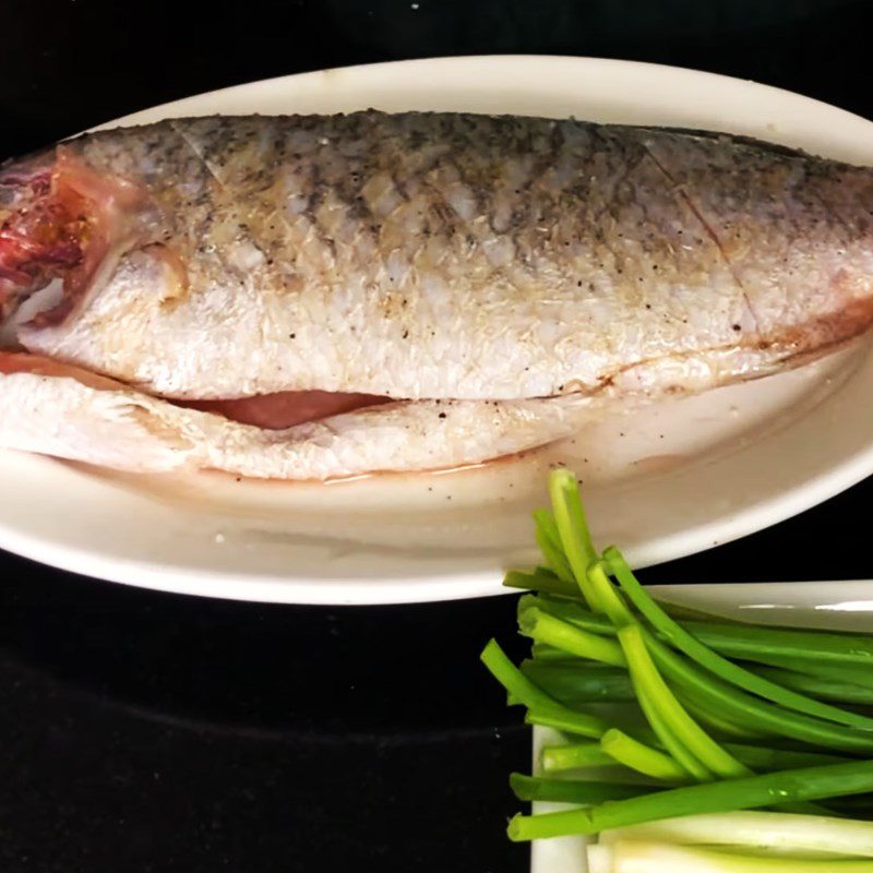 Step 1 Prepare and marinate the fish Ginger Onion Steamed Barramundi