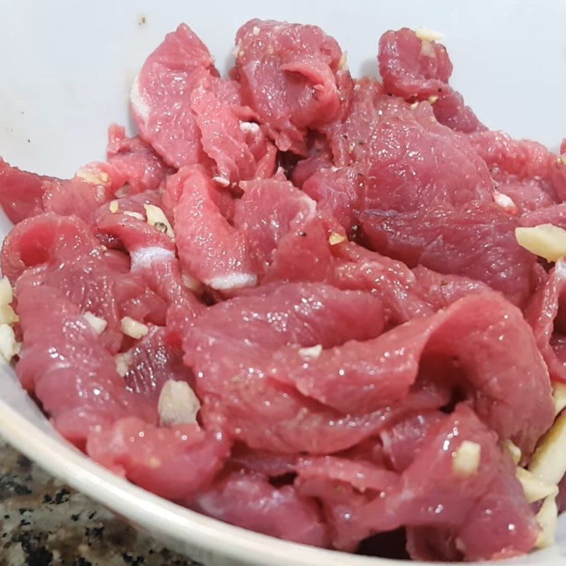 Step 1 Prepare and marinate beef for sweet and sour beef noodle salad