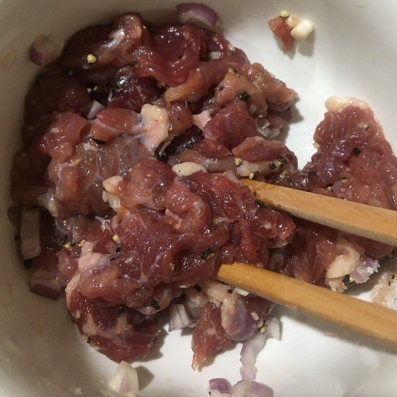 Step 1 Prepare and marinate the beef for Beef Mustard Green Soup