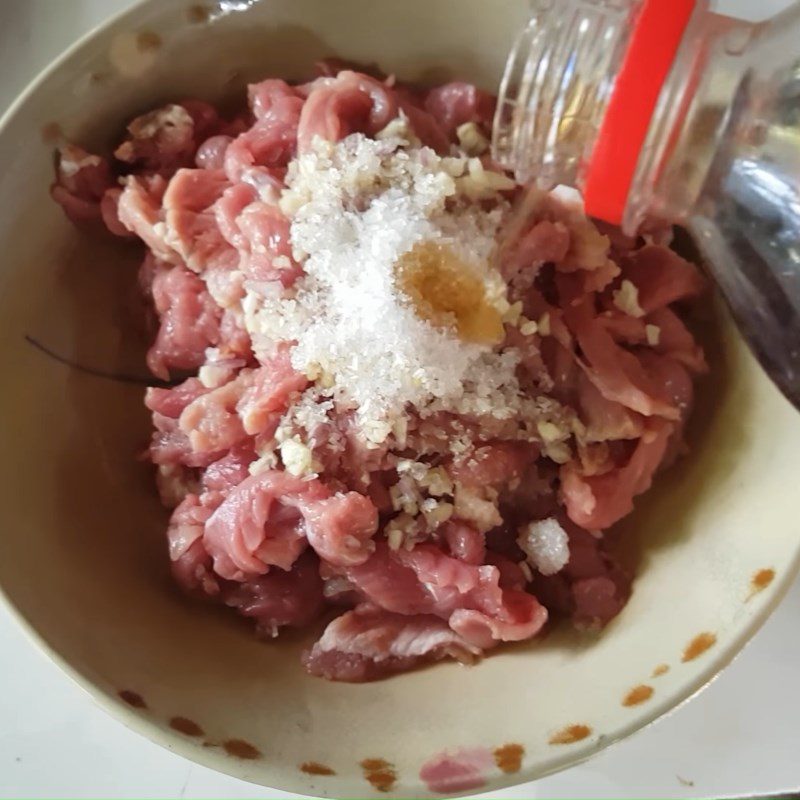 Step 2 Prepare and season the buffalo meat Buffalo meat stir-fried with rice paddy herbs