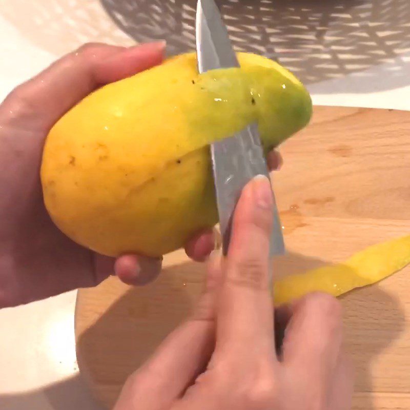 Step 1 Prepare the mango for Mango Yakult Yogurt