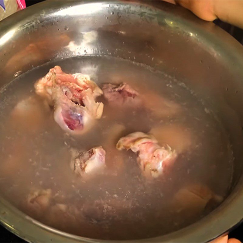 Step 1 Prepare the pork bones for Squid Noodles with Shrimp and Quail Eggs