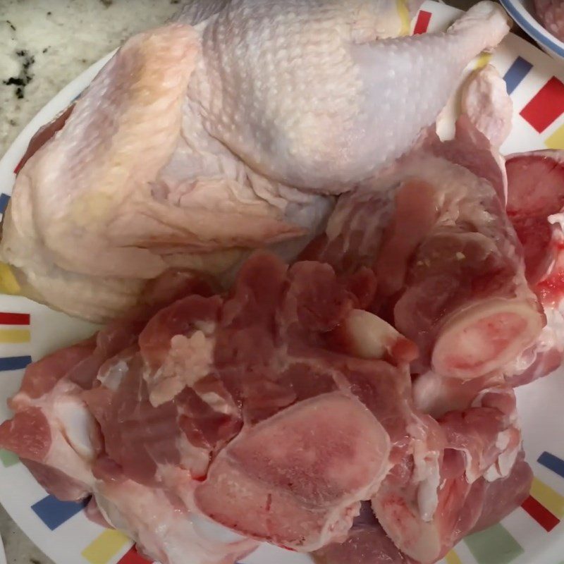 Step 1 Prepare pork bones and chicken for Dry Pho from Gia Lai