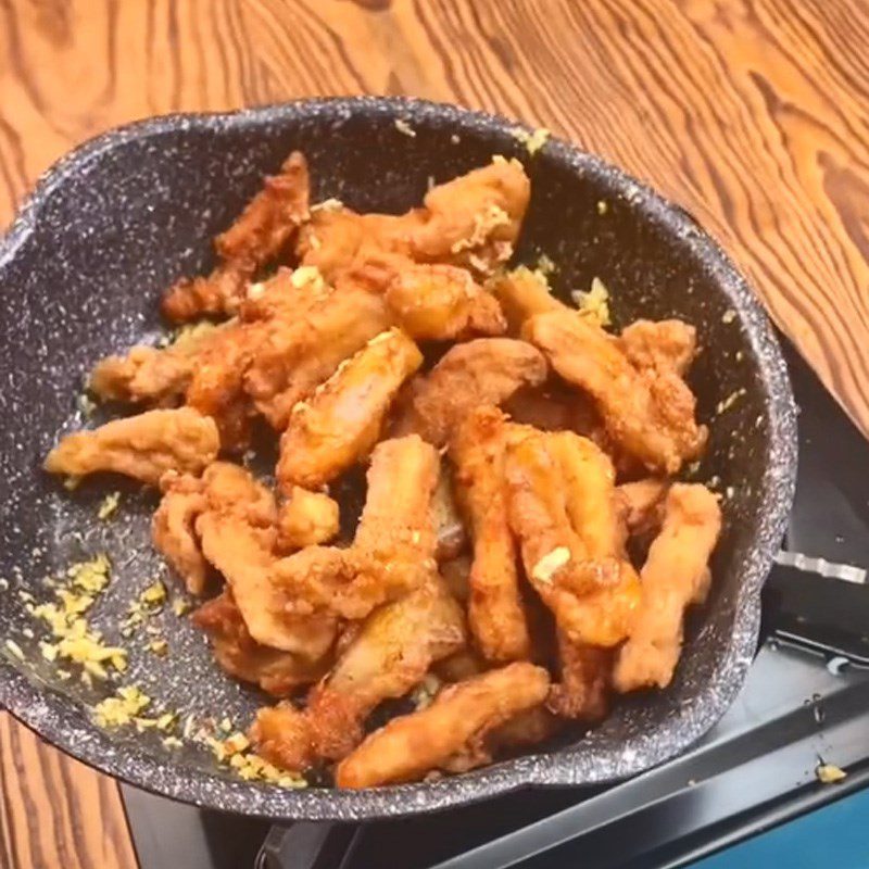 Step 3 Fried chicken cartilage with garlic butter Chicken cartilage fried with garlic butter (Recipe shared from Tiktok Cooking with TasteVN)