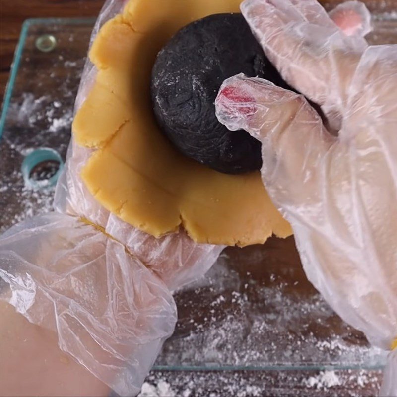 Step 6 Shaping the Moon Cake with black sesame and salted egg